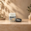 برطمان Morfose Milk Therapy Butter 200 مل مفتوح بجانب غطائه الأسود وقوام الكريم